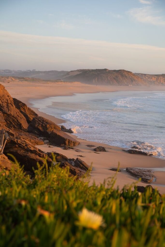 pexels-photo-19338186-19338186 Breathtaking coastal view with waves crashing on rocks at sunset. Perfect for beach lovers.